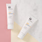 NuSkin Sunright Sonnencreme für Gesicht und Körper (SPF 35 und 50) liegen geschlossen nebeneinander auf glatter Oberfläche.